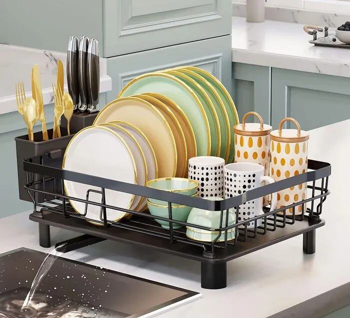 Wash, Dry, And Put Away With Ease, Thanks To The <a Style="Display:inline;" Href="Https://Www.amazon.com/Aiderly-Drainboard-Drainers-Adjustable-Strainers/Dp/B0bk179kps?crid=1lkama9lzb906&dib=eyj2ijoimsj9.jolbcibpjmqsja6g-Cp0ivdjhv0a7nn0aufeoxfodgd-Kgg2k0je1zss-Raamz4aea58rgu7y0gdpmh68te5kbtgl8ikxirdfdzq-Hkaf8gjdygz2pjx8hussllvo5ny8fwaj38ajooy0lts4e2v8sx92ofyblmtwrzdfdxrimzof_zklm01yzuojwrdszyrpb8fuiyqdlaijnisqap-U8y0ebu4uolr0tcqp2qt9xvc-Ea90hwrgdqv6t6rgypovnflxqp3lxvn3eiib67atbyxjvwphrm-9bs-953ojqxwk9q4bfr6pvx2fhblabv2iygkfh1xqfqvhcikue4ufsurcnr7wqfn6mqi9jrxjsc.sxk8-4hacgpwudzrvwgumeqopyodfxpe4rm4opfiohi&dib_tag=se&keywords=kitchen%2bproducts&qid=1736246086&s=kitchen&sprefix=ktichen%2bproduct%2ckitchen%2c194&sr=1-53&xpid=jvpcs2rfyktpv&th=1&linkcode=ll1&tag=bpwoodpecker-20&linkid=52ef02a7d6ec9ee86d2494036c57e586&language=en_us&ref_=as_li_ss_tl" Target="_blank"><span Style="Font: Inherit; Color: #d74b1f;"> Dish Drying Rack With An Extendable Spout </Span>. This Clever Design Directs Water Straight Into The Sink, Keeping Your Countertops Dry And Your Kitchen Tidy