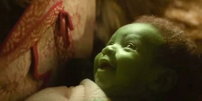 In Wicked (2024), The Onlookers Are Shocked By Baby Elphaba's Appearance. This Is Because Unlike Typical Newborns, She Is Born Spotlessly Clean, Wrinkle-Free, Abnornally Large, And Capable Of Laughter