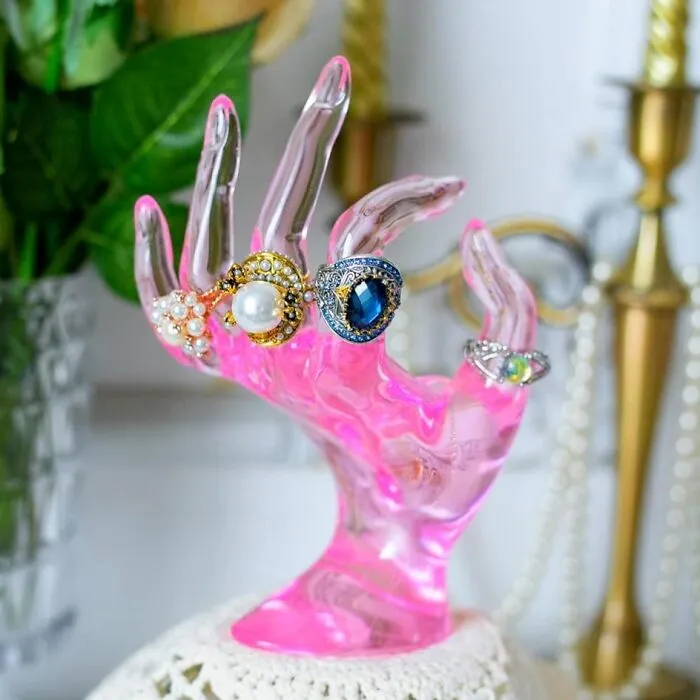 Give Your Jewelry A Hand (Literally) With This Quirky <a Style="Display:inline;" Href="Https://Www.amazon.com/Jewelry-Bracelet-Display-Mannequin-Polyresin/Dp/B091fvs6qc?crid=1vfebygte170b&dib=eyj2ijoimsj9.snspfpaluq5ohwphciaaxcvi3crkkcglitys_yrtj3cqzm0czmg99tjfsvmhwynzuodvv8w1ouksqgcvs084kp8aoehecafzcdyqfovqtzmvcqxmylfq_vaiz9y2s6h6dvtoacsby2t-Ia2uyngl7fj-Cgdlewyiweszu2guyatr2td-Ccptghjg8k8dfoy1npuiprrmxhgtda874fftf40br8usp7chgwhhiuvqt9u.lr4f6hcctc88ribvmhrxnkevj-Xnvryiig3d0tors28&dib_tag=se&keywords=dopamine%2bdecor&qid=1736932523&sprefix=dopamine%2bdecor%2caps%2c211&sr=8-14&th=1&linkcode=ll1&tag=bpfig-20&linkid=21ba091432236a5f24b9fa1b5cfb3e01&language=en_us&ref_=as_li_ss_tl" Target="_blank"><span Style="Font: Inherit; Color: #d74b1f;"> Ring Holder </Span>. This Adorable Pink Resin Hand Keeps Your Rings Organized And Adds A Playful Touch To Your Dresser Or Vanity, Making It A Delightful Conversation Starter And A Guaranteed Mood-Booster