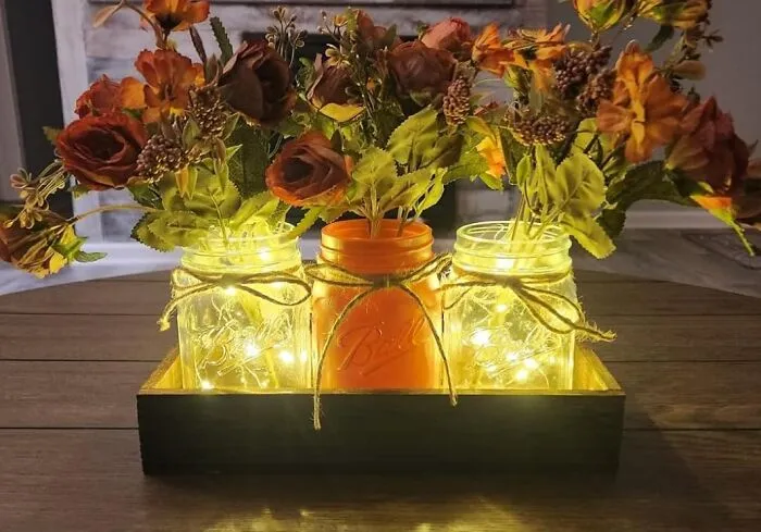 Rustic Charm Meets Whimsical Magic With This <a Style="Display:inline;" Href="Https://Www.amazon.com/Duoer-Centerpiece-Decorations-Farmhouse-Centerpieces/Dp/B0cjj229zx?ie=utf8&th=1&linkcode=ll1&tag=bpfig-20&linkid=6b0b03bbc472aa5b88b4bbb4586dd0a4&language=en_us&ref_=as_li_ss_tl" Target="_blank"><span Style="Font: Inherit; Color: #d74b1f;"> Mason Jar Centerpiece </Span> - Fairy Lights, Wooden Box, And All The Cozy Vibes!
