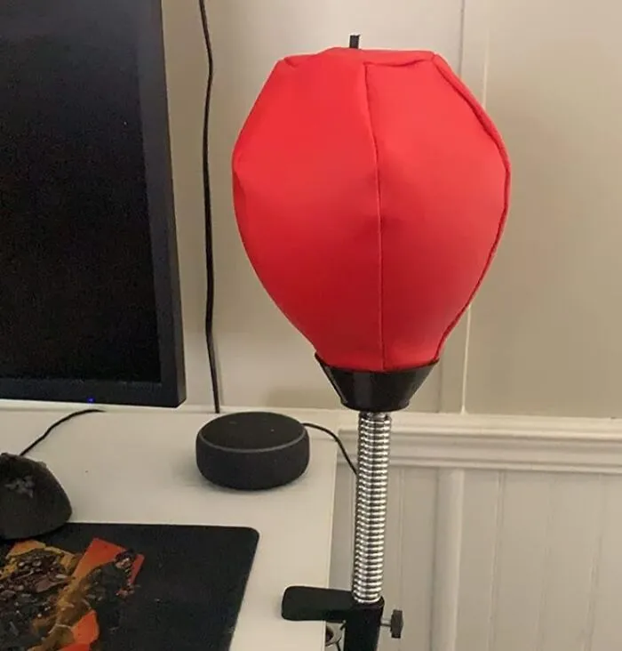 Take Out Your Office Frustrations On The <a Style="Display:inline;" Href="Https://Www.amazon.com/Glacial-Desktop-Punching-Desk-Clamp/Dp/B07d4pssyz?ie=utf8&th=1&linkcode=ll1&tag=bphawk-20&linkid=55a86c41cf6f671fd06cffdcbed74219&language=en_us&ref_=as_li_ss_tl" Target="_blank"><span Style="Font: Inherit; Color: #d74b1f;"> Desktop Punching Bag </Span>. It's A Stress Ball On Steroids