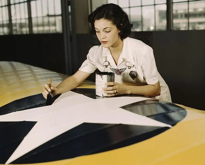 Painting The American Insignia On Airplane Wings Is A Job That Mrs. Irma Lee Mcelroy, A Former Office Worker, Does With Precision And Patriotic Zeal
