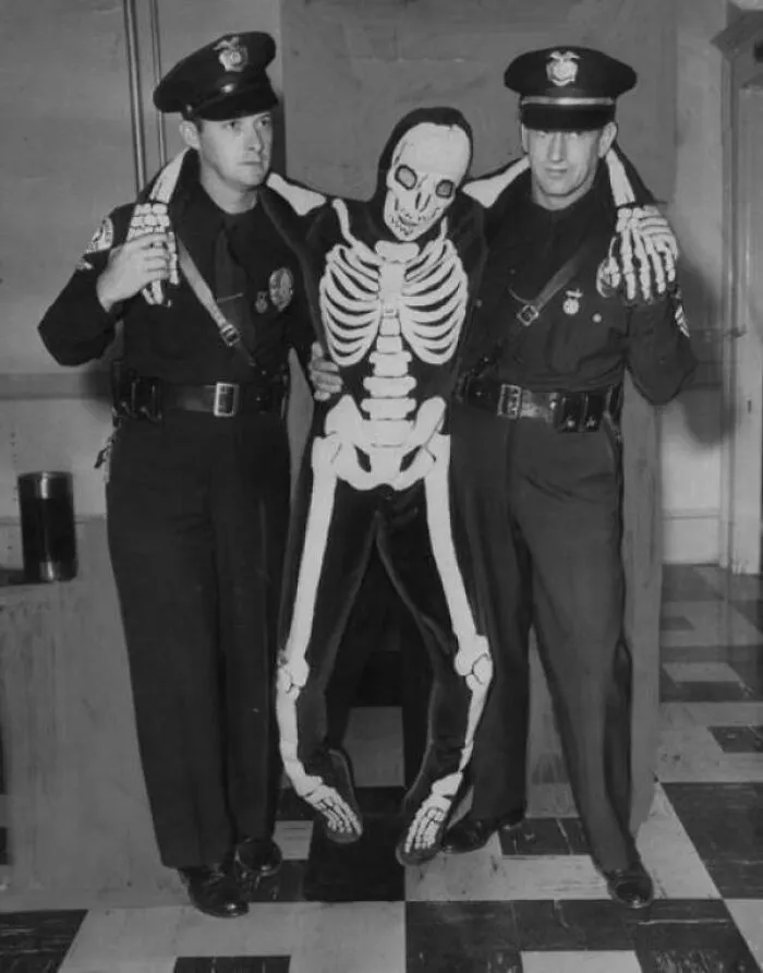 Cops Arresting A Drunk Dude In A Skeleton Costume 1950