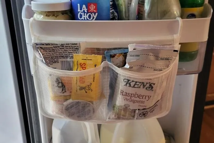 No More Sauce-Y Situations! <a Style="Display:inline;" Href="Https://Www.amazon.com/Refrigerator-Organizer-Household-Sundries-Containers/Dp/B09j4ntvxc?ie=utf8&th=1&linkcode=ll1&tag=bpcamel-20&linkid=3ad98963b2b729d8fdfd7639df3ce120&language=en_us&ref_=as_li_ss_tl" Target="_blank"><span Style="Font: Inherit; Color: #d74b1f;"> Hanging Sauce Packet Organiser</Span> Brings Order To The Condiment Chaos In Your Fridge!