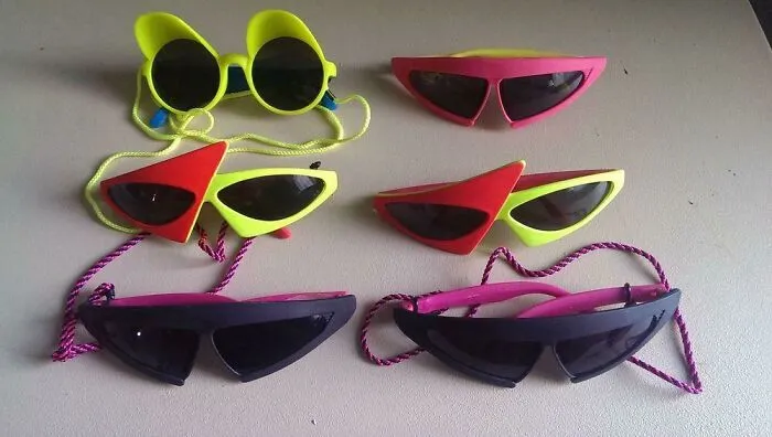 Retro 80s fashion trends featuring colorful and quirky sunglasses on display.