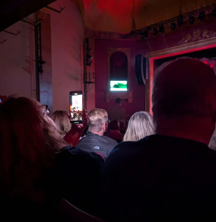 At A Concert With A Woman Who Was Filming With Flash On The Entire Time