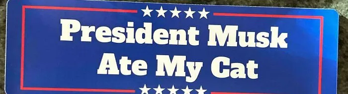 Blue bumper sticker with white text saying "President Musk Ate My Cat," featuring humorous content with decorative stars.