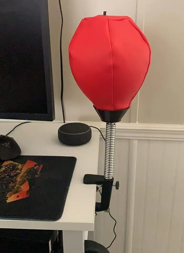 Take A Swing At Stress With This <a Style="Display:inline;" Href="Https://Www.amazon.com/Glacial-Desktop-Punching-Desk-Clamp/Dp/B07d4pssyz?ie=utf8&th=1&linkcode=ll1&tag=bphawk-20&linkid=7a14b251017643f5e2396c77a1f9fcb5&language=en_us&ref_=as_li_ss_tl" Target="_blank"><span Style="Font: Inherit; Color: #d74b1f;"> Desktop Punching Bag </Span>, A Mini But Mighty Way To Release Tension And Add Some Fun To Your Workspace