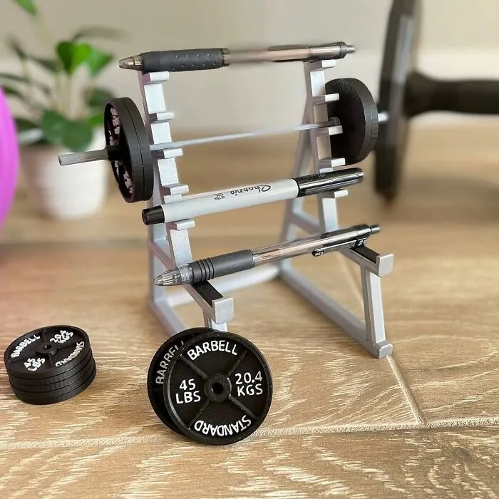 Pump Up Your Productivity With This <a Style="Display:inline;" Href="Https://Www.amazon.com/Zuukhard-Accessories-Organizer-Enthusiasts-Weightlifting/Dp/B0c8588gsb?dib=eyj2ijoimsj9.1ch1qvxkoy0rm7zrv5zpnz0bpeputt8bh-Z7azdr-Tmya-V019xvcovzhk0y4db6fygfhetaows5uivtgkftimgfknt_0vqqbd155z1fhfxqee7ziarvfs87bvkldrtg0bo0s5ccvv6bu_pgmovmsu-H_vspqjotdimacpaeal1d1__qd9r34mzjtjfa90nb9cdajxrv4zn9zv0fdihrs7yohghy78t-4cglqirpiuvo1zhwjpdpoyrhmzea0q1atvzuqgcckcots1hxtawbxzvmkcklne5le-Nvqfwv9tc.qupuool_ahonuawm66k8a2yv-Zmypczyinitj38zpbc&dib_tag=se&keywords=funny+office+gadgets&qid=1738227774&sr=8-1-Spons&sp_csd=d2lkz2v0tmftzt1zcf9hdgy&psc=1&linkcode=ll1&tag=bphawk-20&linkid=854023ab379586097c8575a7764d6c78&language=en_us&ref_=as_li_ss_tl" Target="_blank"><span Style="Font: Inherit; Color: #d74b1f;"> Squat Rack Pen Holder </Span>, A Miniature Gym For Your Pens And Pencils That's A Real Heavyweight In Office Humor