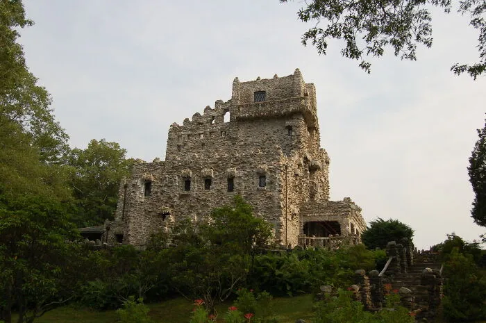 Medieval-style castle surrounded by lush greenery, showcasing one of the amazing views states have to offer.