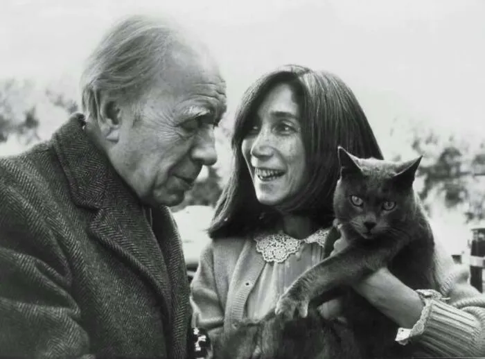 Argentine Writer And Poet Jorge Luis Borges With His Partner Maria Kodama And His Cat. 1980s