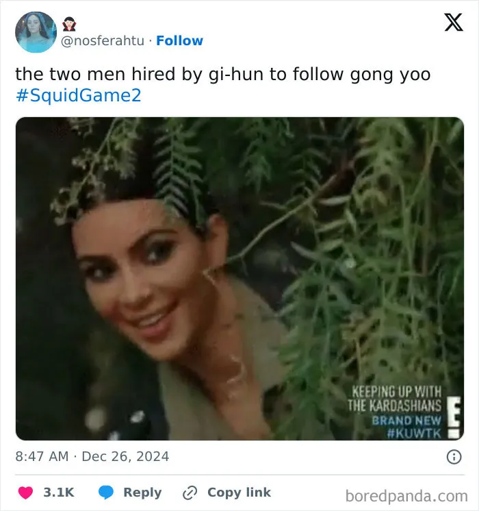 Person peering through leaves with a mischievous expression, referencing "Squid Game 2" in a humorous context.
