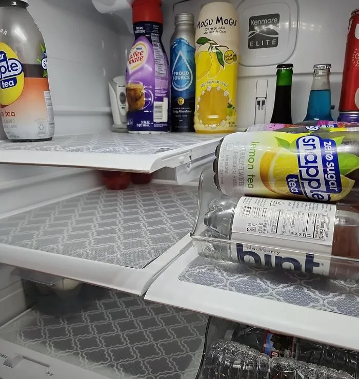 Refrigerator with neatly arranged drinks, showcasing useful things that also look nice.