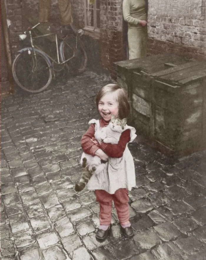 French Girl With Her Cat, 1959 [colorized]