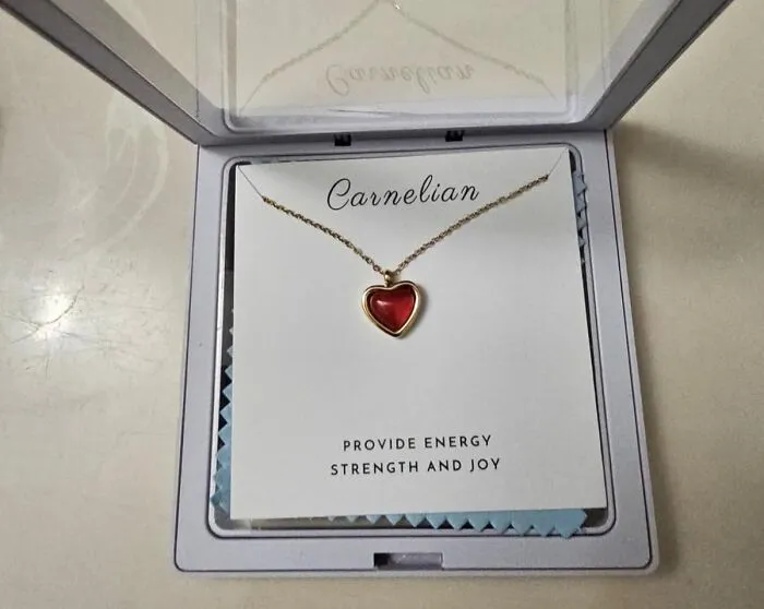 Heart-shaped carnelian necklace, an actually cute gift under $25, in an open box.