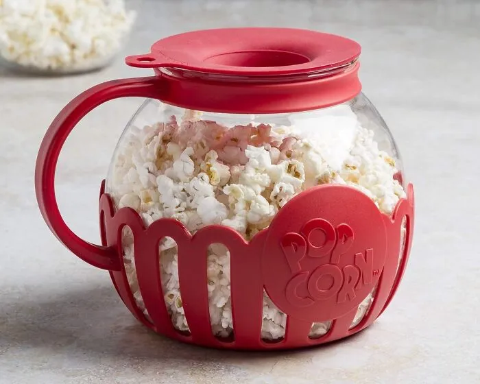 From Lackluster Kernels To Buttery Bliss In Minutes With The <a Style="Display:inline;" Href="Https://Www.amazon.com/Dp/B019hr91w4?ascsubtag=7817456%2c20%2c33%2cd%2c0%2c0%2c0%2c1396%3a1%3b900%3a2%3b974%3a3%3b1125%3a2%3b1338%3a1%2c57726323%2c0%2c0%2cgoogle&btn_ref=srctok-B454dbca4c4b1939&th=1&linkcode=ll1&tag=bpgrape-20&linkid=e0d3e15ef0ed222f3e020f9f616696f0&language=en_us&ref_=as_li_ss_tl" Target="_blank"><span Style="Font: Inherit; Color: #d74b1f;"> Microwavable Popcorn Maker </Span>. A Movie Night Staple That's Ready For Its Close-Up! Because Even In The Age Of Streaming, Popcorn Will Reign