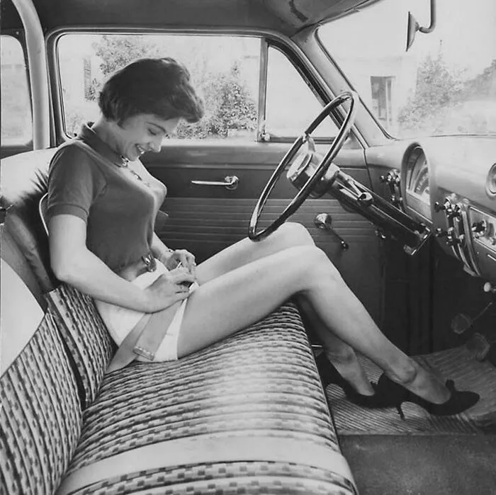 Woman Inspecting This New Thing, The Security Belt In Her Car, Circa 1950s