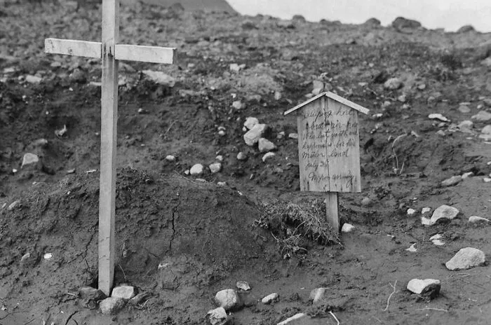 The Grave Of An American Pilot Buried By Imperial Japanese Troops. The Sign Reads "Sleeping Here, A Brave Air-Hero Who Lost Youth And Happiness For His Mother Land. July 25 - Nippon Army". Kiska, Alaska, 25 August 1943