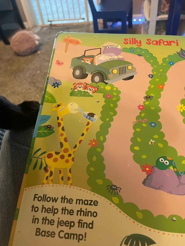 Children's book with a safari maze, featuring a rhino in a jeep. Example of poorly-designed books.