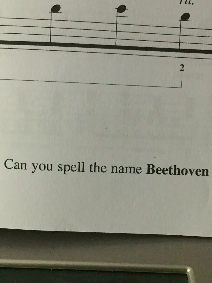 Sheet music with text: "Can you spell the name Beethoven," illustrating poorly-written-designed-books.