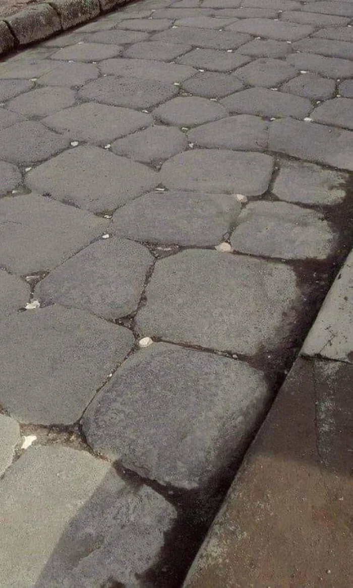 In Ancient Rome, Roads Were Dotted With White Stones (Cats' Eyes) Which Reflected The Moonlight, Acting As Street Lights To Help People Walk On The Street After Dark. Pictured Is A Roman Road In Pompeii 