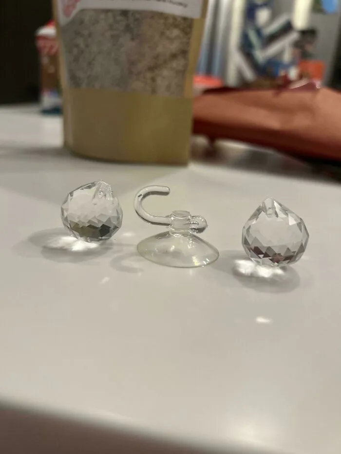 Gifted From A Student. Two Small Crystal Balls With A Hook That Has A Suction Cup On It. The Balls Each Have A Little Hole And A Little Divot. Any Ideas?