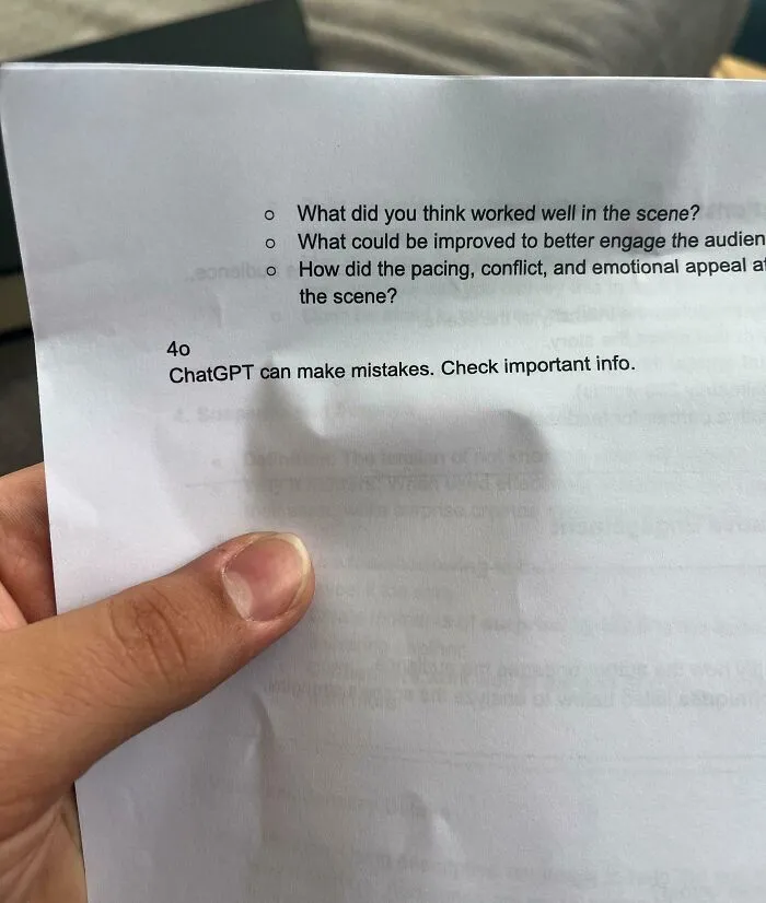 Hand holding a sheet with discussion questions and a note about AI inaccuracies, relating to bad infuriating teachers.