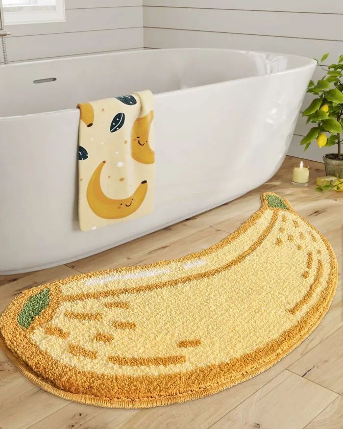 Go Bananas For Bath Time With This <a Style="Display:inline;" Href="Https://Www.amazon.com/Lumi-Bathroom-Absorbent-Non-Slip-Stylish/Dp/B0cphzyth9?crid=2xz4n5p91o7yh&dib=eyj2ijoimsj9.nonqj61xfcagdze-Ltt8o8h5er6g9iq45poe7zj-2obst0lxtmamnfku868ucjzanlhsjw6q1ercbmbmujvodoq87oaiw_qzp6sqsuxn8kiauzldvchlsca925xjmkwtxvbpu1lsp4gnuh4d0heybkbkgmwk3kikxasxtwoeabsw6e15qkmbeuldje7g5mlhtmddxf9ewfepdvneesnhk4l6jtb057d8icwunx7vvzn18bwuzvwn66eu1rn04zfntfxrymyqrg9_yb818rkfmdk_krv3phffsodvkmqbehi5yjiivjnbymooarxyb-Pse1tx7vnggkojnv2rn_d3_maggshzzio6fdw_0xrwjvqelmml1r8vk7mbiya4eaxzc3lor6thnwcdyrvyyodwzwrg8p2yl-Jrw39mfsk2sfnzfgjsn4wwsiwdfxudpx6n.ndq6qqgzbakf86eujxcfnduiojox1ssxdoirpciqt8m&dib_tag=se&keywords=funny%2bbathroom%2brugs&qid=1739884324&sprefix=funny%2bbathroom%2brug%2caps%2c213&sr=8-32&th=1&linkcode=ll1&tag=bpmelon-20&linkid=c84a4cfbdf82ca70c9a383d37361c289&language=en_us&ref_=as_li_ss_tl" Target="_blank"><span Style="Font: Inherit; Color: #d74b1f;"> Banana Rug</Span> That's Ripe For Making Your Bathroom A Whole Lot Cooler