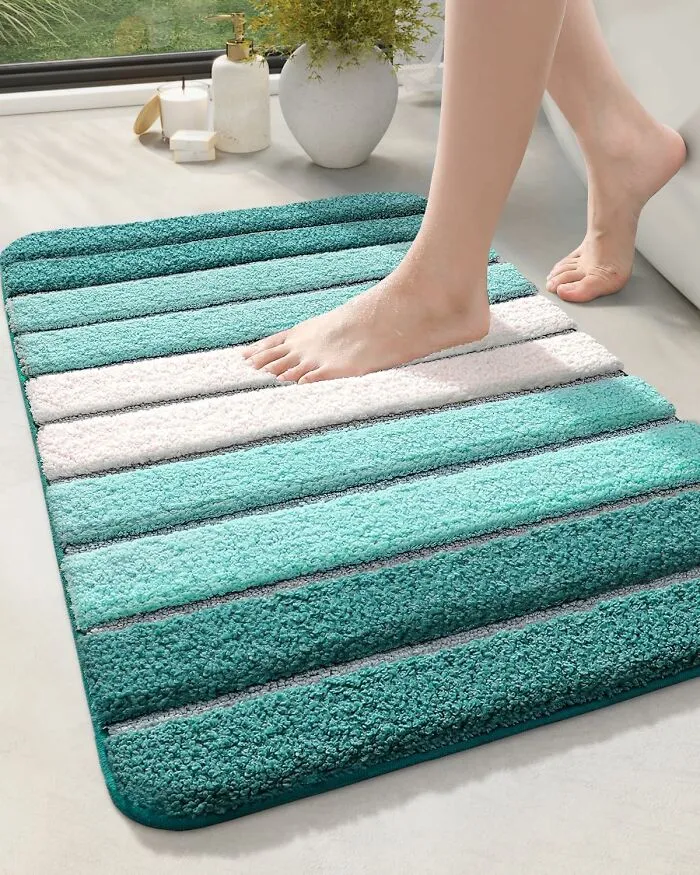Step Onto Spa Vibes With This <a Style="Display:inline;" Href="Https://Www.amazon.com/Dexi-Bathroom-Absorbent-Non-Slip-Turquoise/Dp/B08fhrpd3k?crid=39ab738ono634&dib=eyj2ijoimsj9.x-9ldn5drgewlkfqe7hbnl2lhyylhmowc8-Zav2gl4i5a6akyx0tpzcvojvqx1wahb9_znwsq5ymof7qn9i_fil-W7evbuenkdq4b7-X7cfcxmfd497ihxpcvxbfhhjomtnqcmbpxtx9laywziean8xurf9fifmy0m6n9nphrvea49fj__9ptydnkuduaf6dgo9ps_mheq4h8rgkcbslicj67sd0velmg6ymsqaleorxsw5bbh1epqo5c6o47wdfhssue_uvrjzqmi_6upfq8uri9nwbw0unu0qfs33rhz1msn9qb30zupbvmo_nhidfxhdyq3_9lyuofcj_gdwcmz5nv3kdmc1bw8trchpim6e0erz9_mziioeufgzjgawdc8salowsucietf_nmakerz4124ghmp2uvj-3pf59m92c5emkyvnkkhdg_amp3udu.kizdmsdtker6_c8wi4ieern8nle_8wtrwauvl5ibk4k&dib_tag=se&keywords=bathroom%2brugs&qid=1739884029&sprefix=bathroom%2brug%2caps%2c197&sr=8-149&xpid=lx1ogm4hfmzea&th=1&linkcode=ll1&tag=bpmelon-20&linkid=bc5f01dee934ef2375b8fd7899570574&language=en_us&ref_=as_li_ss_tl" Target="_blank"><span Style="Font: Inherit; Color: #d74b1f;"> Striped Rug</Span>, Where Post-Shower Feels Are All About Minimalist Zen