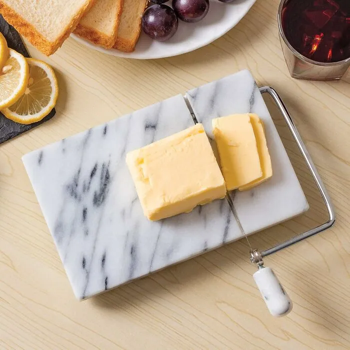 Elevate Your Snack Game With The Sleek Sophistication Of A <a Style="Display:inline;" Href="Https://Www.amazon.com/Dp/B0000vza2w?ascsubtag=7825018%2c7%2c31%2cd%2c0%2c0%2cbf-Web-Hf%2c1396%3a1%3b900%3a2%3b974%3a3%3b1125%3a2%3b1338%3a1%2c58302509%2c0%2c0&th=1%25252c0%252c0%2c0&btn_ref=srctok-Da9eee96df4e1125&linkcode=ll1&tag=bpbison-20&linkid=59ff03143f8080ee8200668236bf7c46&language=en_us&ref_=as_li_ss_tl" Target="_blank"><span Style="Font: Inherit; Color: #d74b1f;"> Marble Cheese Slicer </Span> That's Almost Too Fancy For Netflix Nights Alone