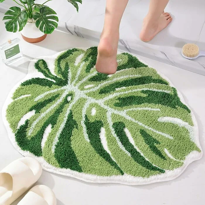 Bring Chill Nature Vibes With This <a Style="Display:inline;" Href="Https://Www.amazon.com/Panstar-Monstera-Bathtub-Bathroom-Washable/Dp/B0b49sk1pk?content-ID=amzn1.sym.efb24060-AC75-4e87-B0fd-1ea18cfee5f4%3aamzn1.sym.efb24060-AC75-4e87-B0fd-1ea18cfee5f4&crid=39ab738ono634&cv_ct_cx=bathroom%2brugs&keywords=bathroom%2brugs&pd_rd_i=b0b49sk1pk&pd_rd_r=1799a4cf-7aef-40c3-B08a-D2b31c1d3a19&pd_rd_w=9ekml&pd_rd_wg=xcttv&pf_rd_p=efb24060-AC75-4e87-B0fd-1ea18cfee5f4&pf_rd_r=1hr0pc641r8v6pjs1537&qid=1739883960&sbo=rzvfv%2f%2fhxdf%2bo5021pansa%3d%3d&sprefix=bathroom%2brug%2caps%2c197&sr=1-4-D1931c17-4371-4e59-Bbe3-Ace4c8b0d213-Spons&sp_csd=d2lkz2v0tmftzt1zcf9zzwfyy2hfdghlbwf0awnfynrm&th=1&linkcode=ll1&tag=bpmelon-20&linkid=4d00a787b40125663b15c88774955c16&language=en_us&ref_=as_li_ss_tl" Target="_blank"><span Style="Font: Inherit; Color: #d74b1f;"> Leaf Rug</Span>—the Perfect Addition To Your Green Dream Bathroom