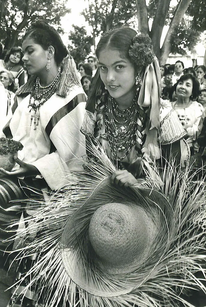 In The Middle Of A Celebration, A Young Woman From Oaxaca, Mexico, Notices She Is Being Photographed, And Gives A Look To The Camera, 1985