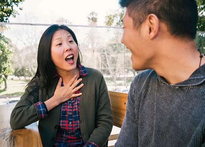 Man and woman having a heartfelt conversation on a sunny day, highlighting relationship insights.