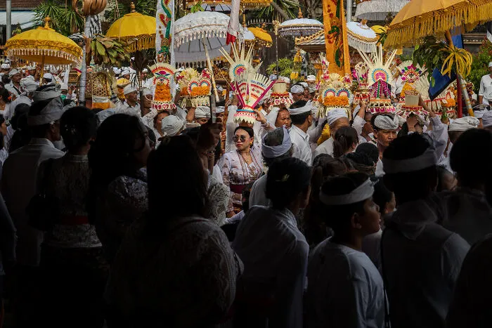 A Marching Group Was Walking At A Fast Pace While Onlookers Watched The Spectacle. This Cool Balinese Lady Captured The Spotlight In A Split Second