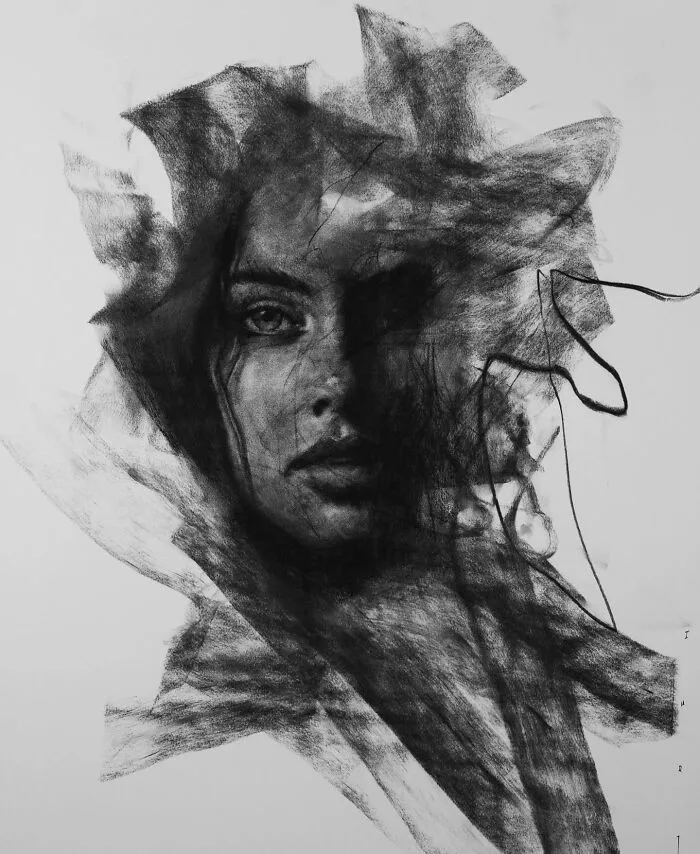 Charcoal portrait by Josh Hernandez, depicting an expressive face with abstract shading and intricate details.