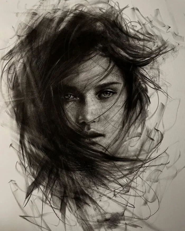Charcoal portrait by Josh Hernandez depicting a woman's face with intricate shading and dynamic lines.