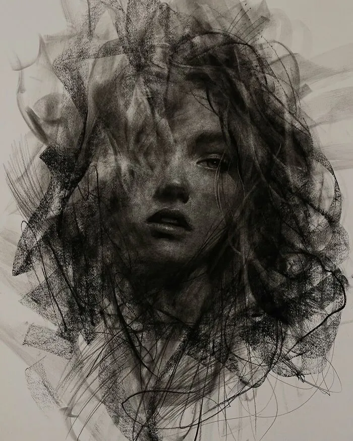 Charcoal portrait by artist, featuring an abstract, detailed depiction of a woman's face amid swirling textures.