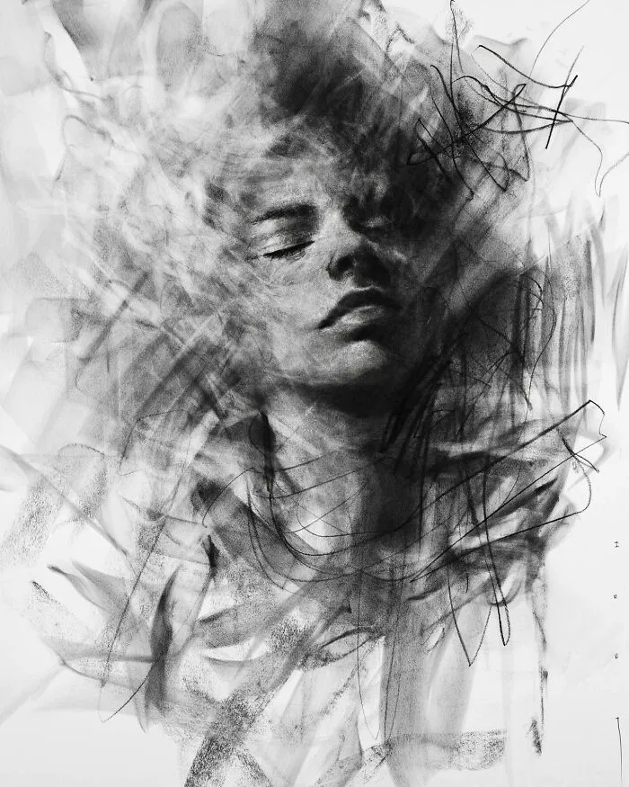 Charcoal portrait by Josh Hernandez, depicting a serene face emerging from abstract strokes.