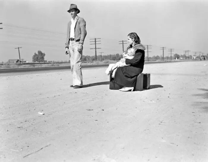 Dorothea Lange - Young Family Hitchhiking On U.S. Highway 99 In California