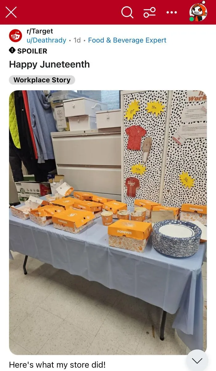 Popeyes chicken boxes on a table, part of a Juneteenth workplace celebration display.