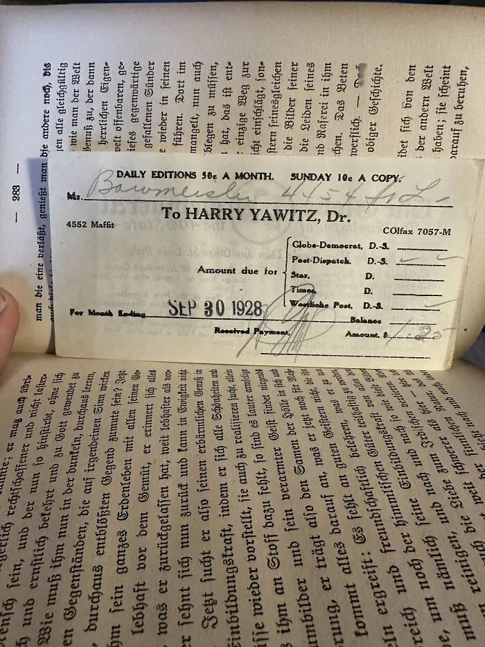 Old invoice used as a bookmark in a book, dated 1928.