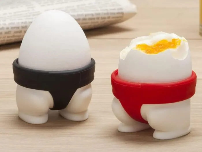 Are You Ready To Wrestle With A New Way To Serve Eggs, 'Cause These <a Style="Display:inline;" Href="Https://Www.amazon.com/Peleg-Design-Holders-Utensil-Kitchen/Dp/B00m0iyf9w?&linkcode=ll1&tag=bppanther-20&linkid=917f79ff69b95a81a457738067e0c7cc&language=en_us&ref_=as_li_ss_tl" Target="_blank"><span Style="Font: Inherit; Color: #d74b1f;"> Sumo Egg Cups</Span> Are About To Bring Some Serious Breakfast Muscle To Your Morning Routine