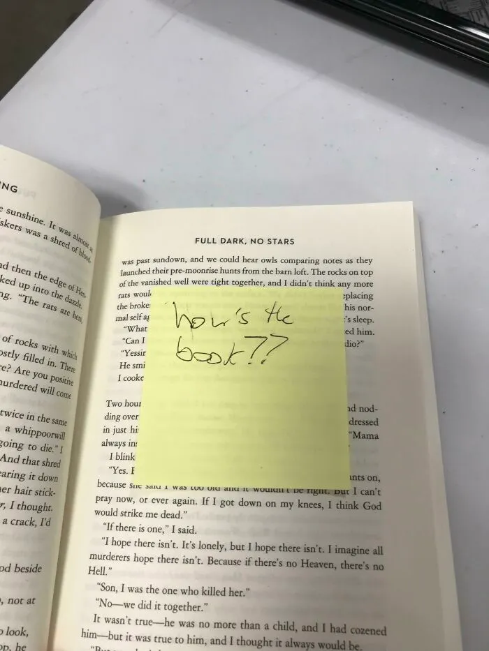 Book lovers' bookmark with handwritten question on a sticky note inside "Full Dark, No Stars" book.
