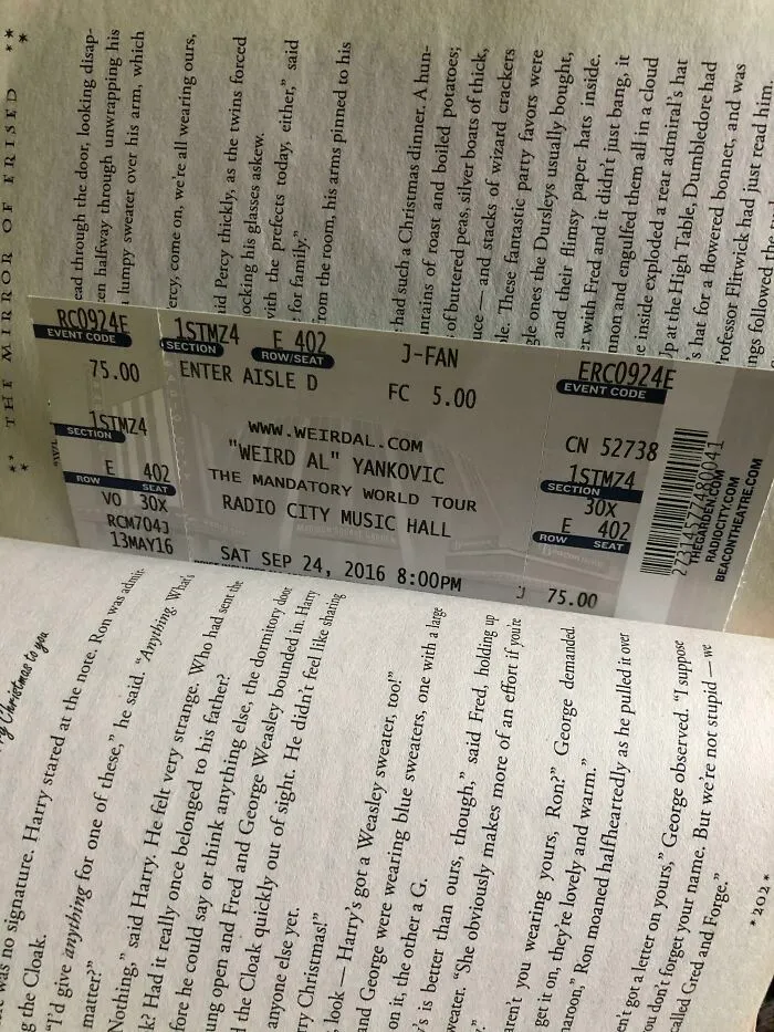 Concert ticket used as a bookmark inside a book by a book lover.