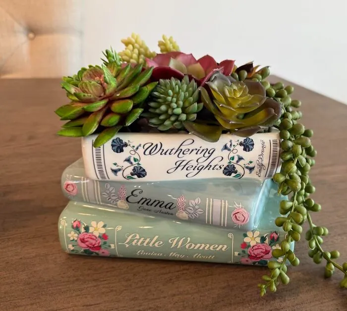 Shelfie Goals Incoming. Reading With Plants Is The Vibe You Get With This <a Style="Display:inline;" Href="Https://Www.amazon.com/Book-Shaped-Decorative-Planter-Bookshelf-Bookstack/Dp/B0cq64ly3b?ie=utf8&linkcode=ll1&tag=bpwolf-20&linkid=f78c4065597c4dfcdda017f5072a7567&language=en_us&ref_=as_li_ss_tl" Target="_blank"><span Style="Font: Inherit; Color: #d74b1f;"> Book Shaped Planter</Span> Which Perfectly Combines Literary Charm With Botanical Beauty