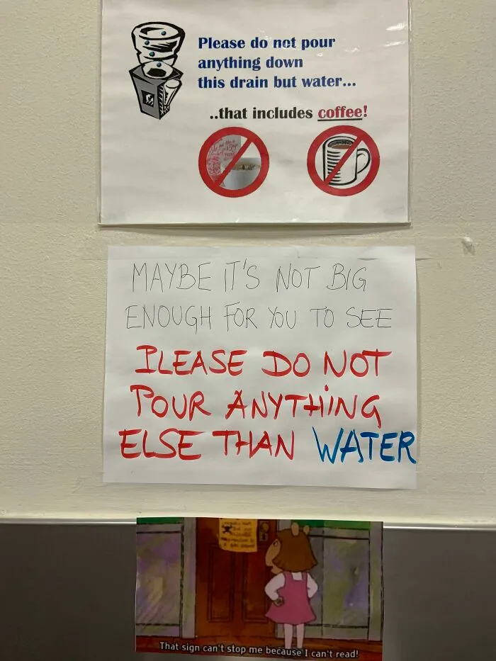 Funny passive-aggressive sign about not pouring anything but water down drain, with sarcastic cartoon response.