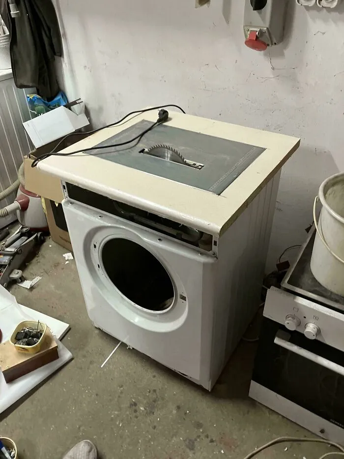 Homemade table saw made from a repurposed washing machine, showcasing redneck engineer ingenuity and practical creativity.