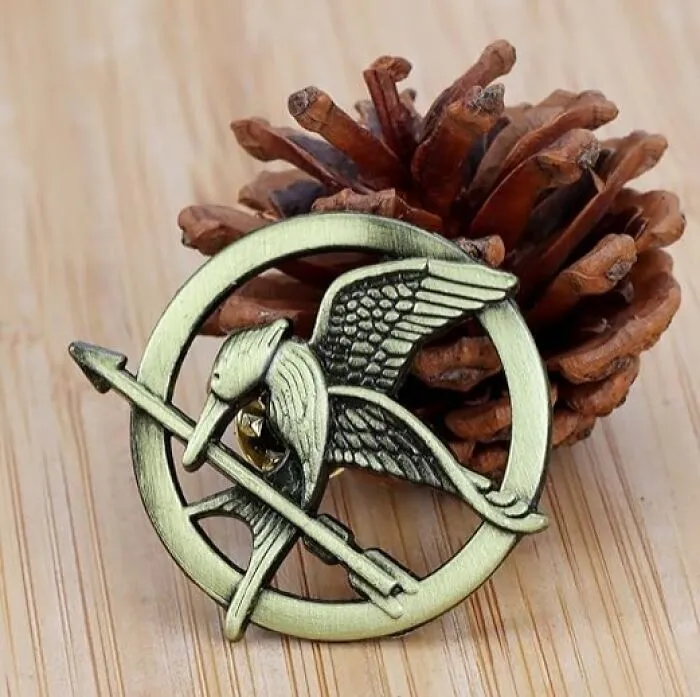 Join The Rebellion In Style With The <a Style="Display:inline;" Href="Https://Www.amazon.com/Ekz-Katniss-Everdeen-Mockingjay-Enthusiasts/Dp/B0cm9qf7ft?dib=eyj2ijoimsj9.gp9uen_whp88n5hmmyf74lacb2rgeithjgjvpnl1jsfw3uv_p-L2j4tcppqrzveh-Gay623x5bafb2bfszvw4nlim_5oqxjd2wglae5txe92xelpjfkhzmnrmtnrnzqmbtcqhxzzczwiugua20rqk9rguq2ijxhjz1zvjfj7tsiz5xcuo5n60qfrdo_fdvxsnallluzuyjsxskyryngo66kpq9r4wfm_ut8-Ibosxwmj1hl3g4vgwy80aklb_39re8v74qz4vvwt-Wk2yp8uldgrx43achpifuubbuao9sgyswb4dyr-Icaa6wqaajk2c-Oeqym8heemibqkdvizzs_aaonhjmrdnlabgmmrvs-Ycmvfngnrei0aeep7crjjsl235lodrgctt2w7szpbj86stznotnk9m1fkmgkdwerhydw0omtq87awydzpl87o.pmhvbol-Lcxcx4xpyjkctoyhadbdvjqpkp7_5ji0dc4&dib_tag=se&keywords=movie+props&qid=1742199430&sr=8-72&linkcode=ll1&tag=bpmelon-20&linkid=177a8c5ed6a570dcc449a3fe3d036ba7&language=en_us&ref_=as_li_ss_tl" Target="_blank"><span Style="Font: Inherit; Color: #d74b1f;"> Mockingjay Pin</Span>, A Powerful Symbol Of Defiance And Hope From The Hunger Games That's Sure To Inspire Your Inner Katniss