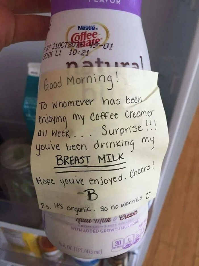 Passive-aggressive note on coffee creamer bottle reveals it's actually breast milk, with a smiley face for humor.