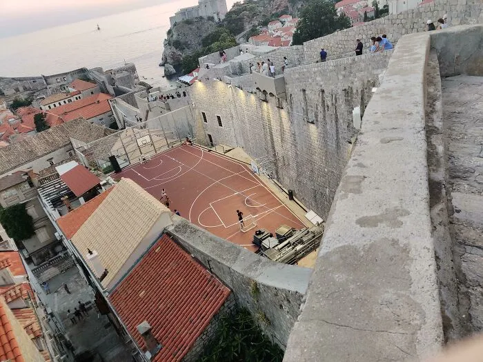 A Modern Day Basketball Court Against 700 Year Old Walls In Dubrovnik, Croatia